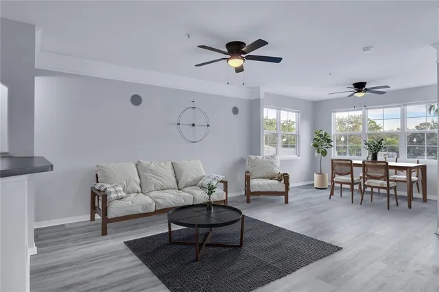 a living room with furniture and a large window