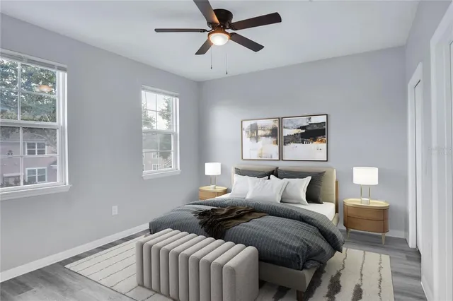 a bedroom with furniture and a window