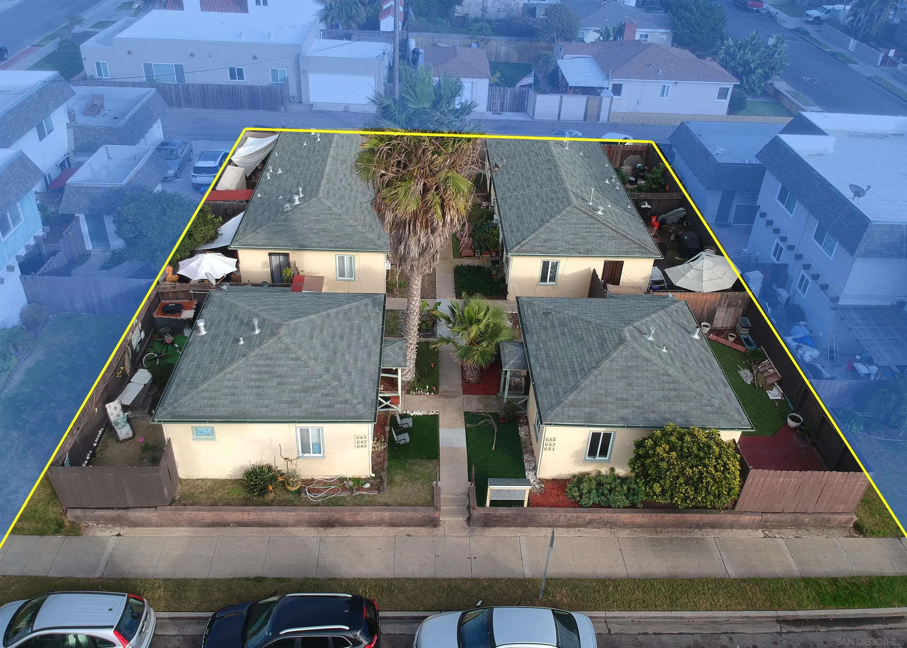 645-655 Seacoast Drive Imperial Beach, CA 91932 - Photo 1 of 10 an aerial view of a house with a yard