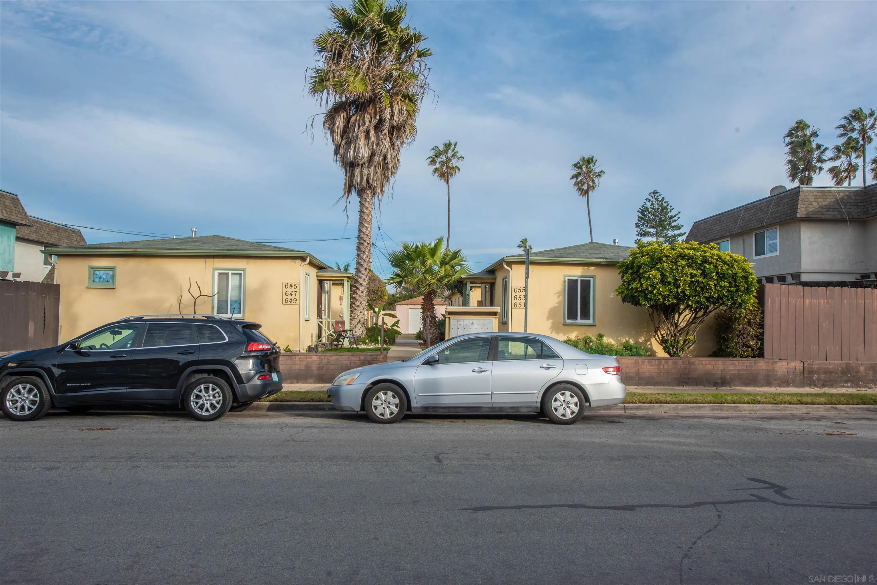 645-655 Seacoast Drive Imperial Beach, CA 91932 - Photo 3 of 10 front view of a house with car parked