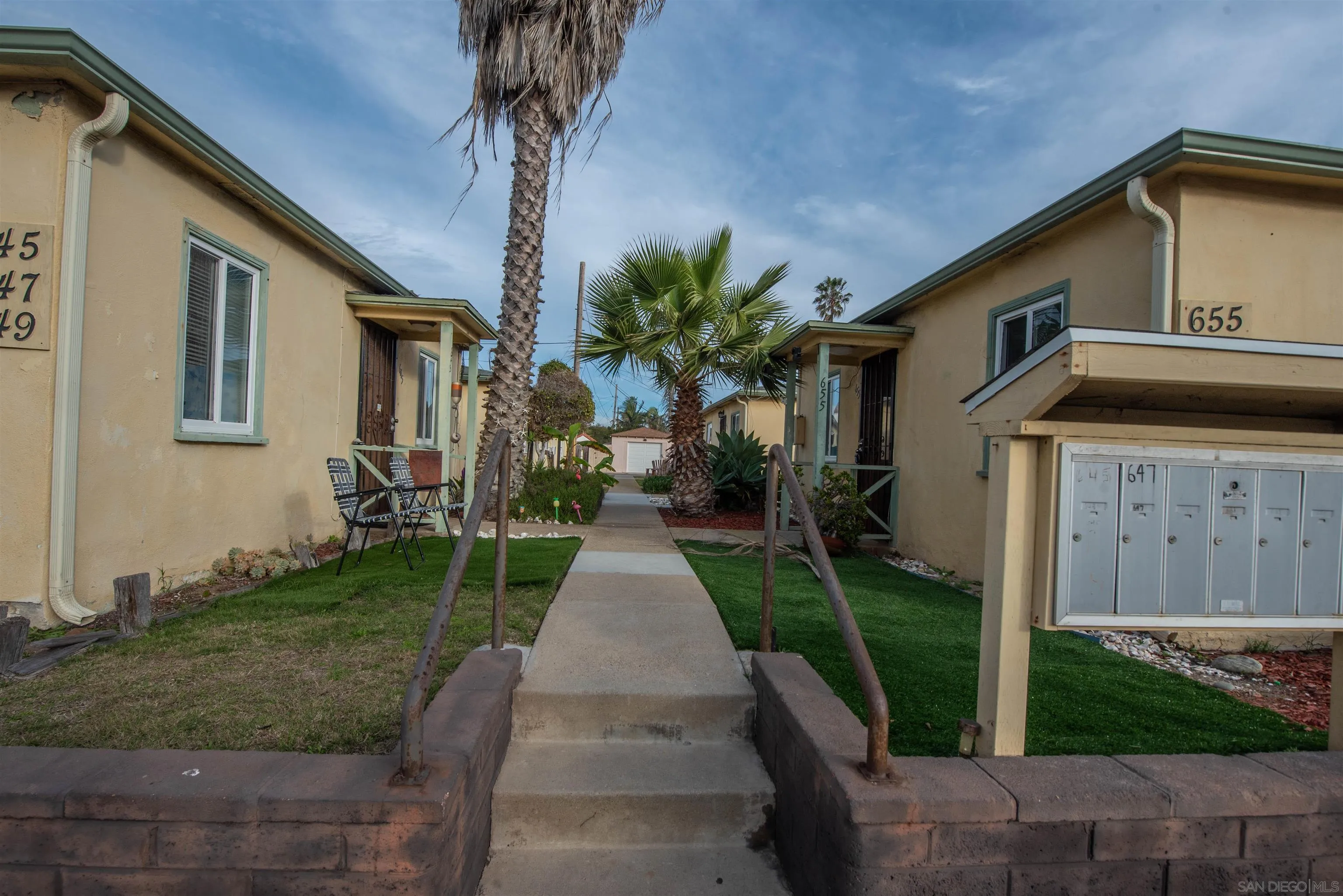 645-655 Seacoast Drive Imperial Beach, CA 91932 - Photo 5 of 10 a front view of a house with a yard