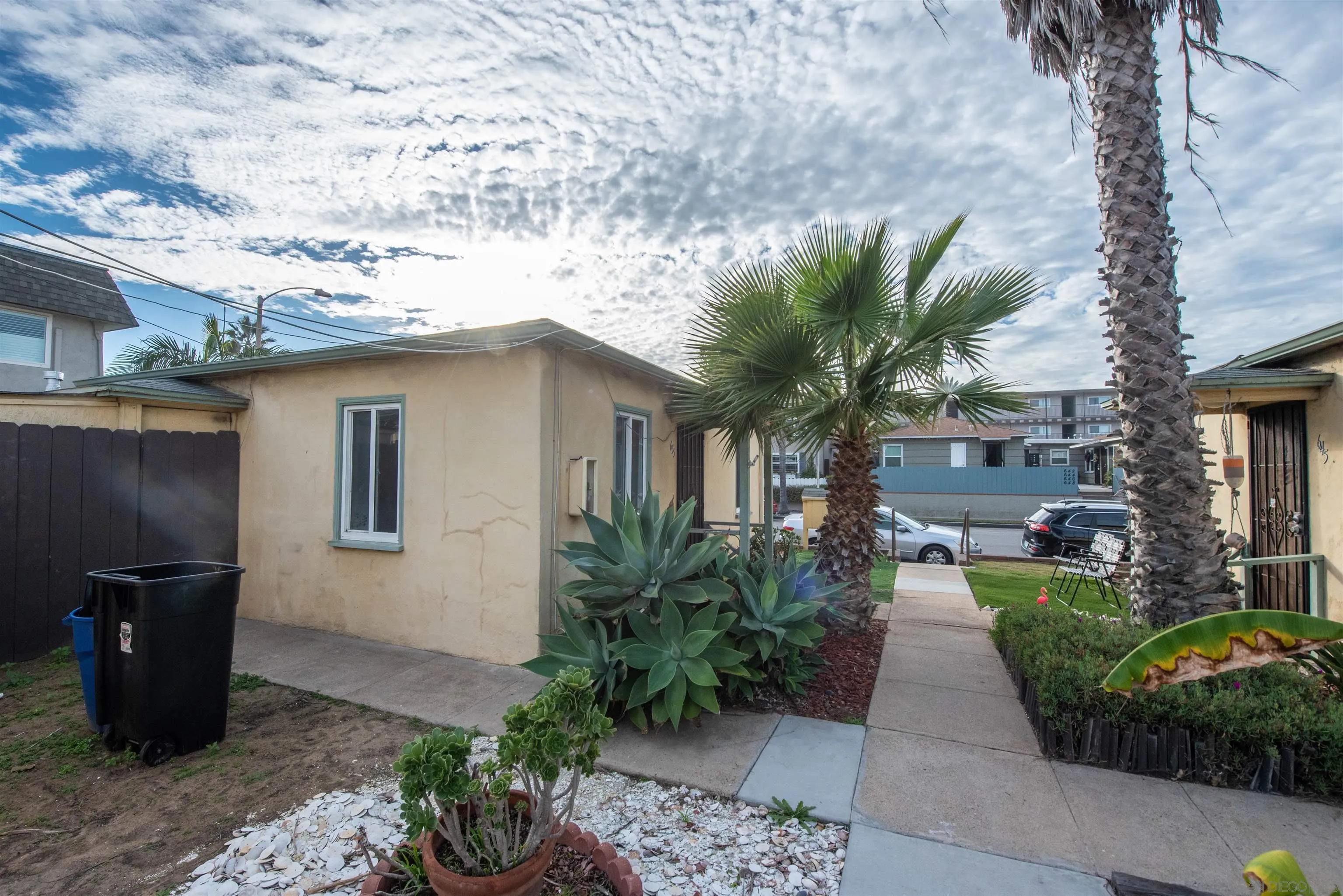 645-655 Seacoast Drive Imperial Beach, CA 91932 - Photo 6 of 10 a front view of a house with garden