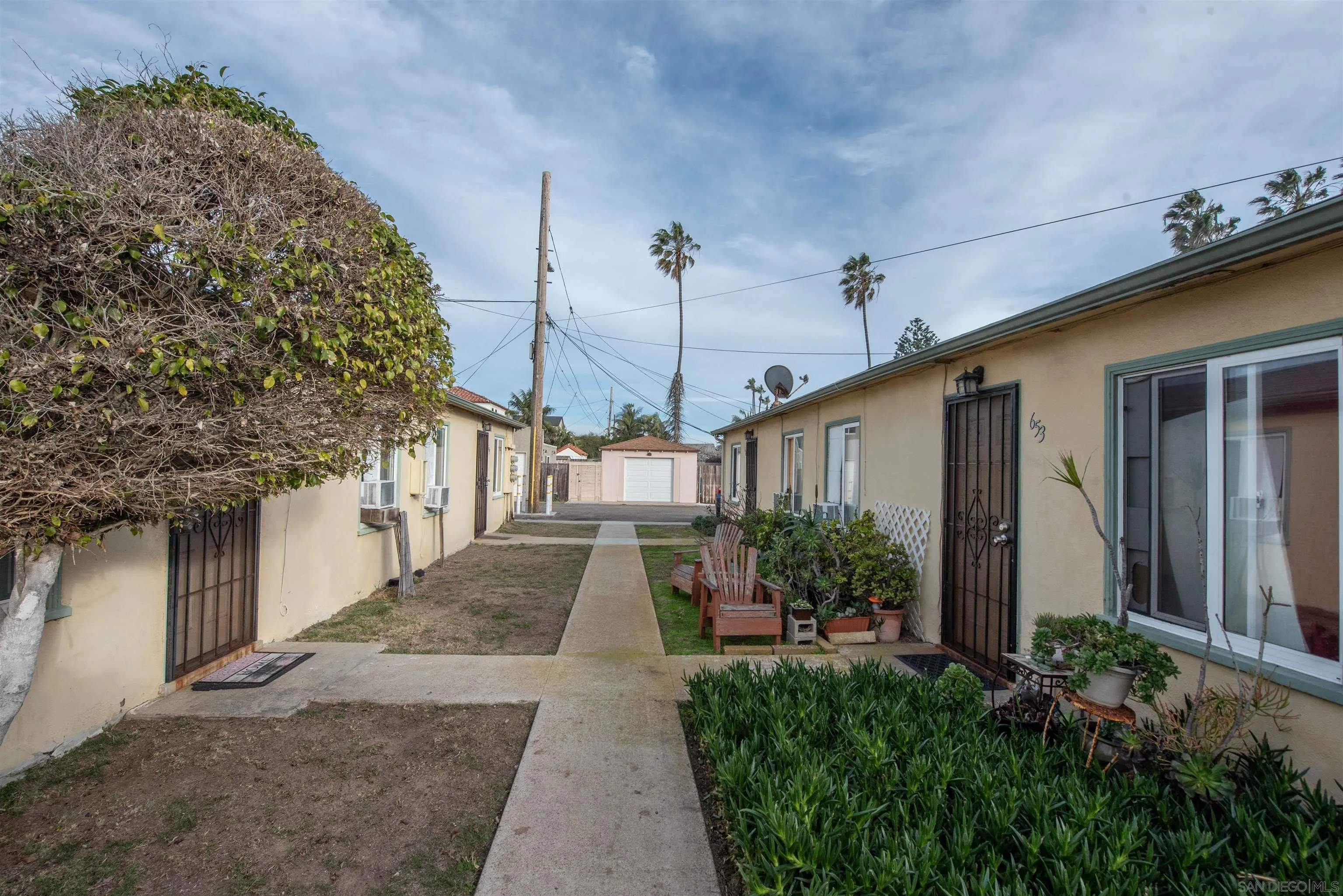 645-655 Seacoast Drive Imperial Beach, CA 91932 - Photo 8 of 10 a view of a house with a yard