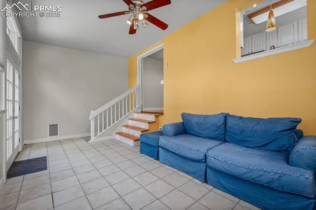 a living room with furniture and a rug