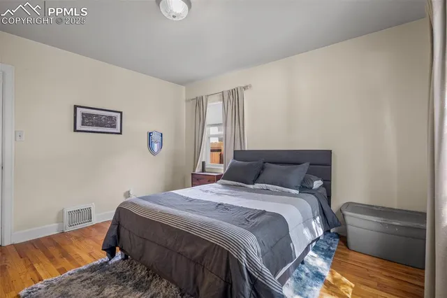 a bedroom with a bed and a couch