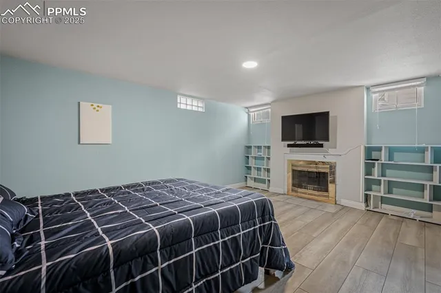 a bedroom with a bed and a television