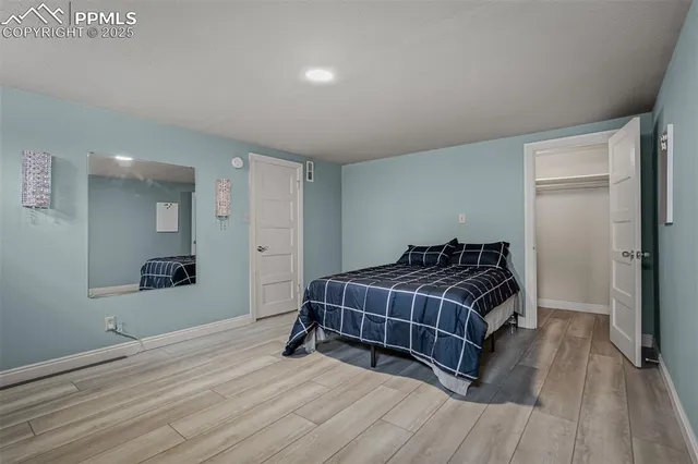 a room with a bed and a mirror