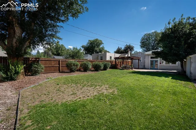 a front view of house with yard and outdoor seating