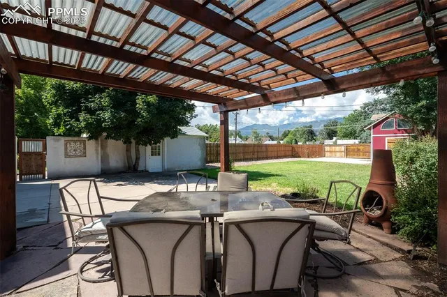 a view of yard with patio