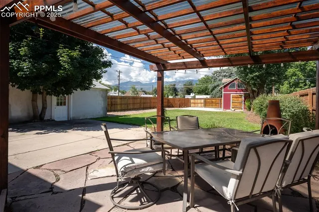 a view of backyard with sitting area