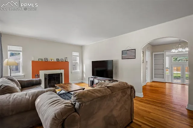 a living room with furniture and a fireplace