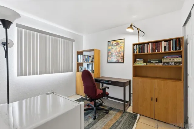 a workspace with furniture and a window