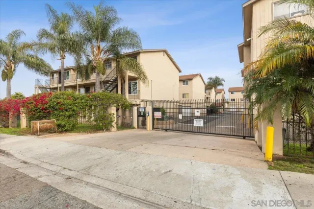 a view of a street with a building in the background