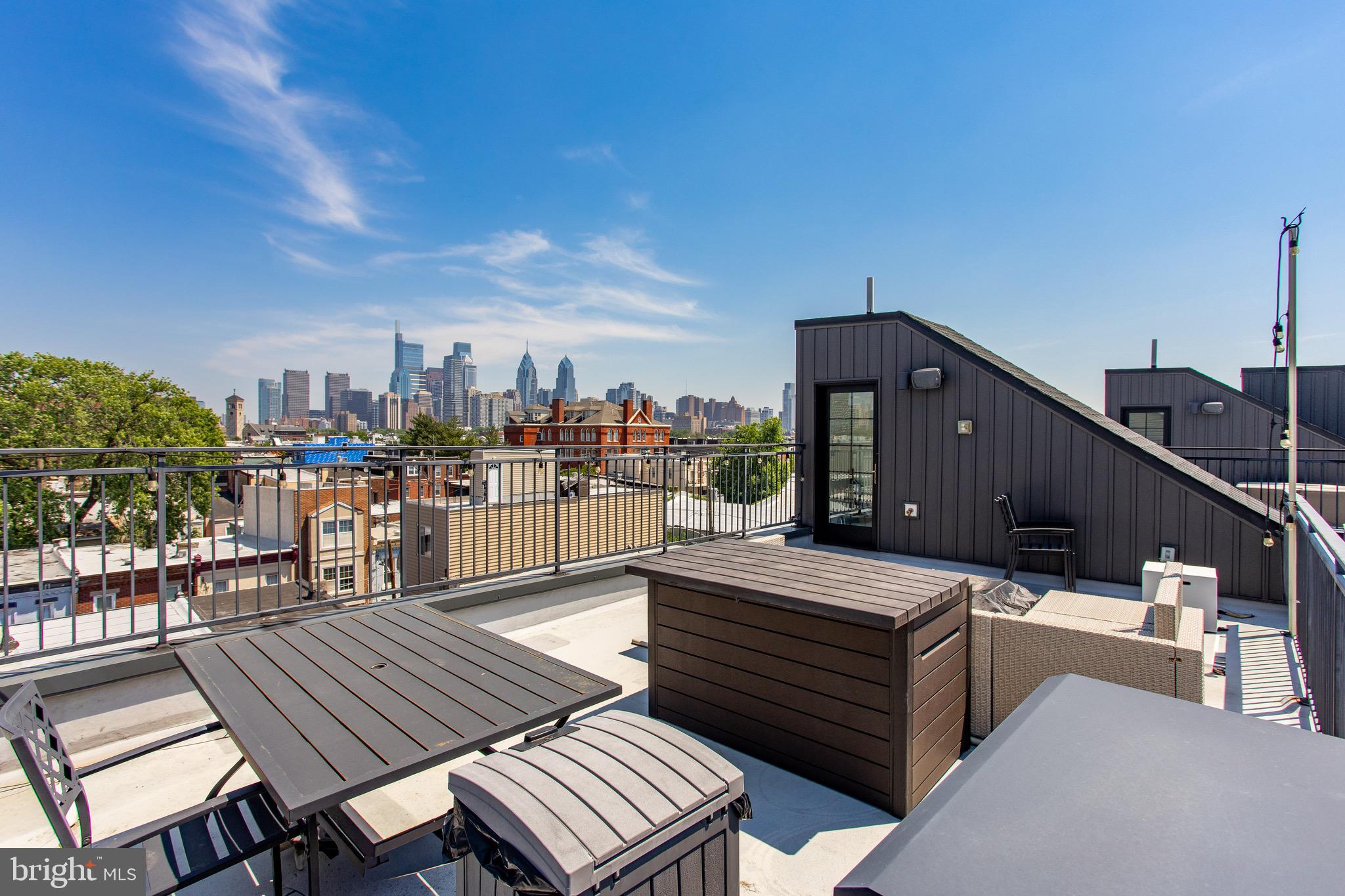 2411 Innovator Way Philadelphia, PA 19146 - Photo 25 of 26 a view of a rooftop deck with chairs and wooden floor