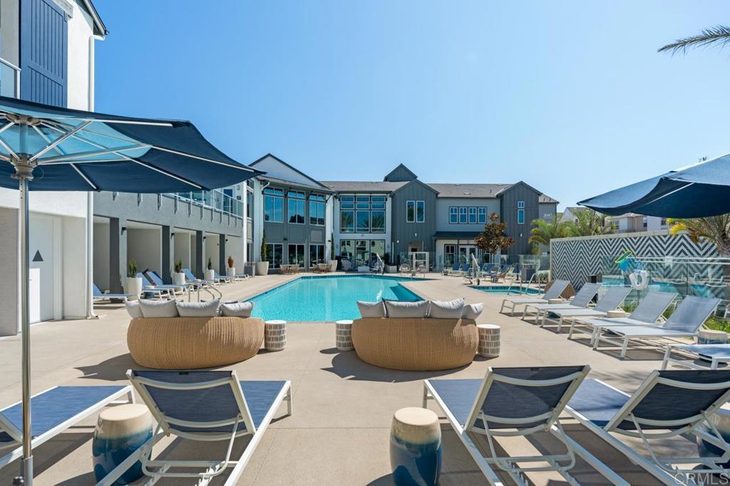 2060 Paseo Belluno, Unit 6 Chula Vista, CA 91913 - Photo 17 of 64 a view of a house with backyard sitting area and swimming pool