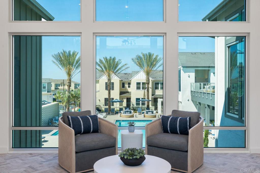 2060 Paseo Belluno, Unit 6 Chula Vista, CA 91913 - Photo 2 of 64 a living room with furniture potted plant and a large window