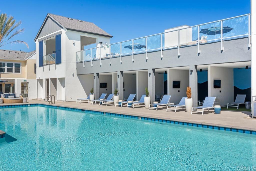 2060 Paseo Belluno, Unit 6 Chula Vista, CA 91913 - Photo 25 of 64 a view of a patio with dining table and chairs with plants and wooden fence