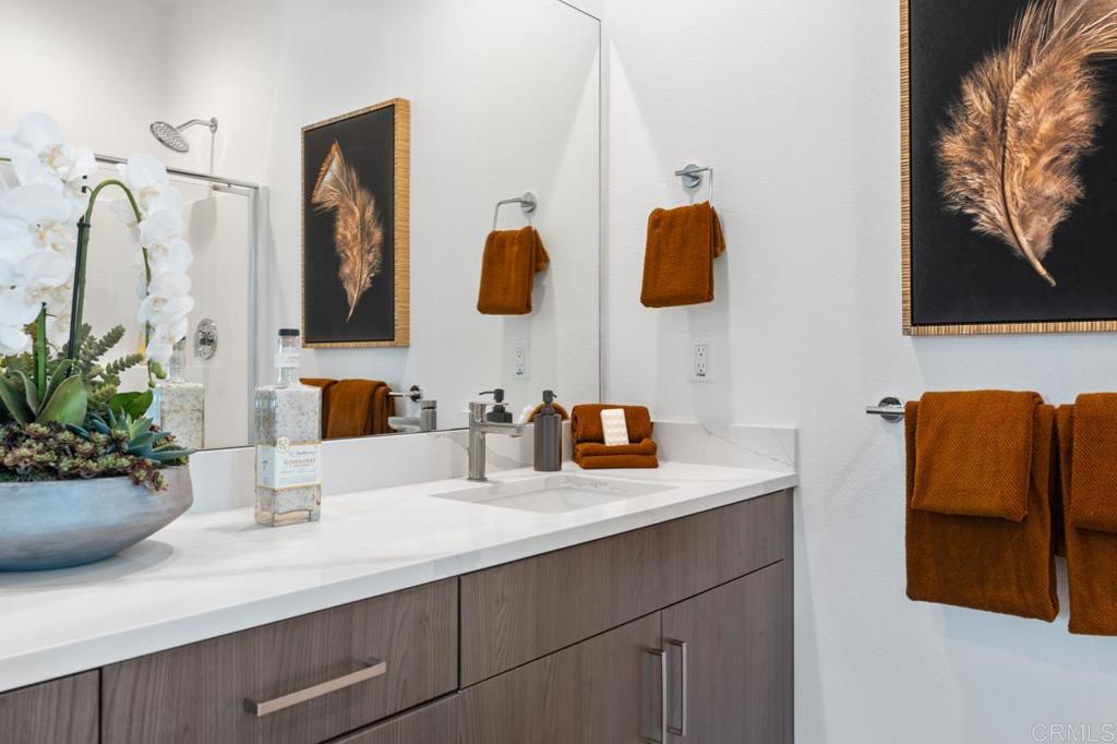 2060 Paseo Belluno, Unit 6 Chula Vista, CA 91913 - Photo 57 of 64 a bathroom with a sink and a mirror