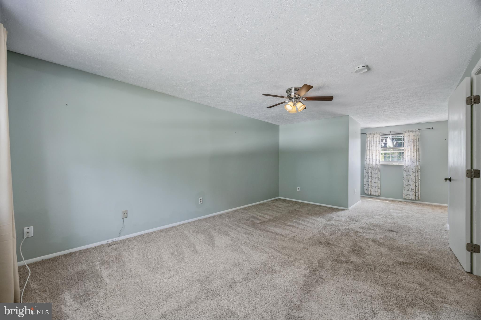 1506 Gollum Road Hanover, MD 21076 - Photo 30 of 44 a view of an empty room and a ceiling fan