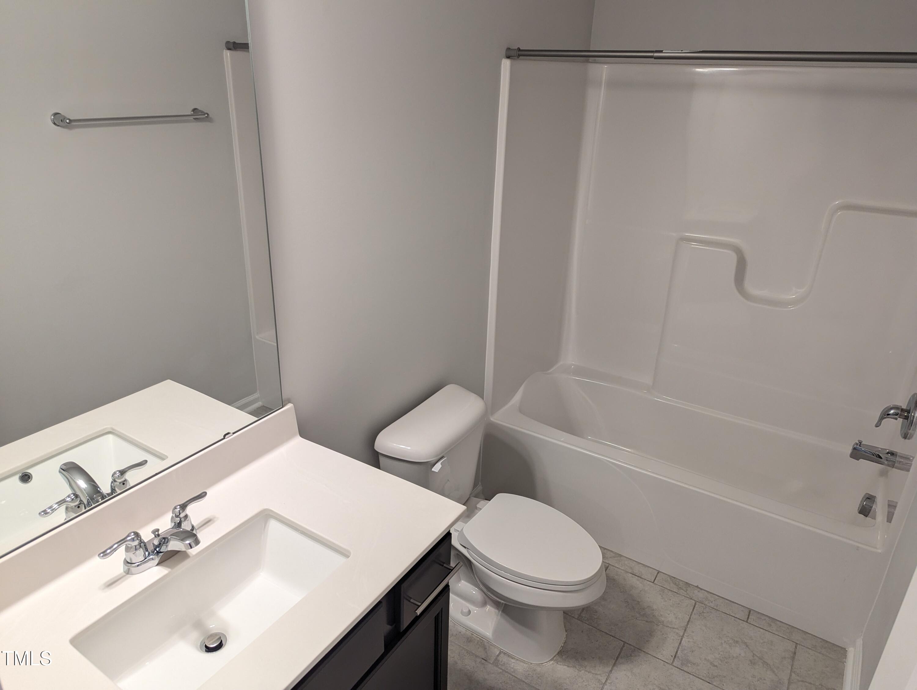 4020 Whitney Peak Drive Raleigh, NC 27616 - Photo 14 of 21 a bathroom with a sink toilet and shower