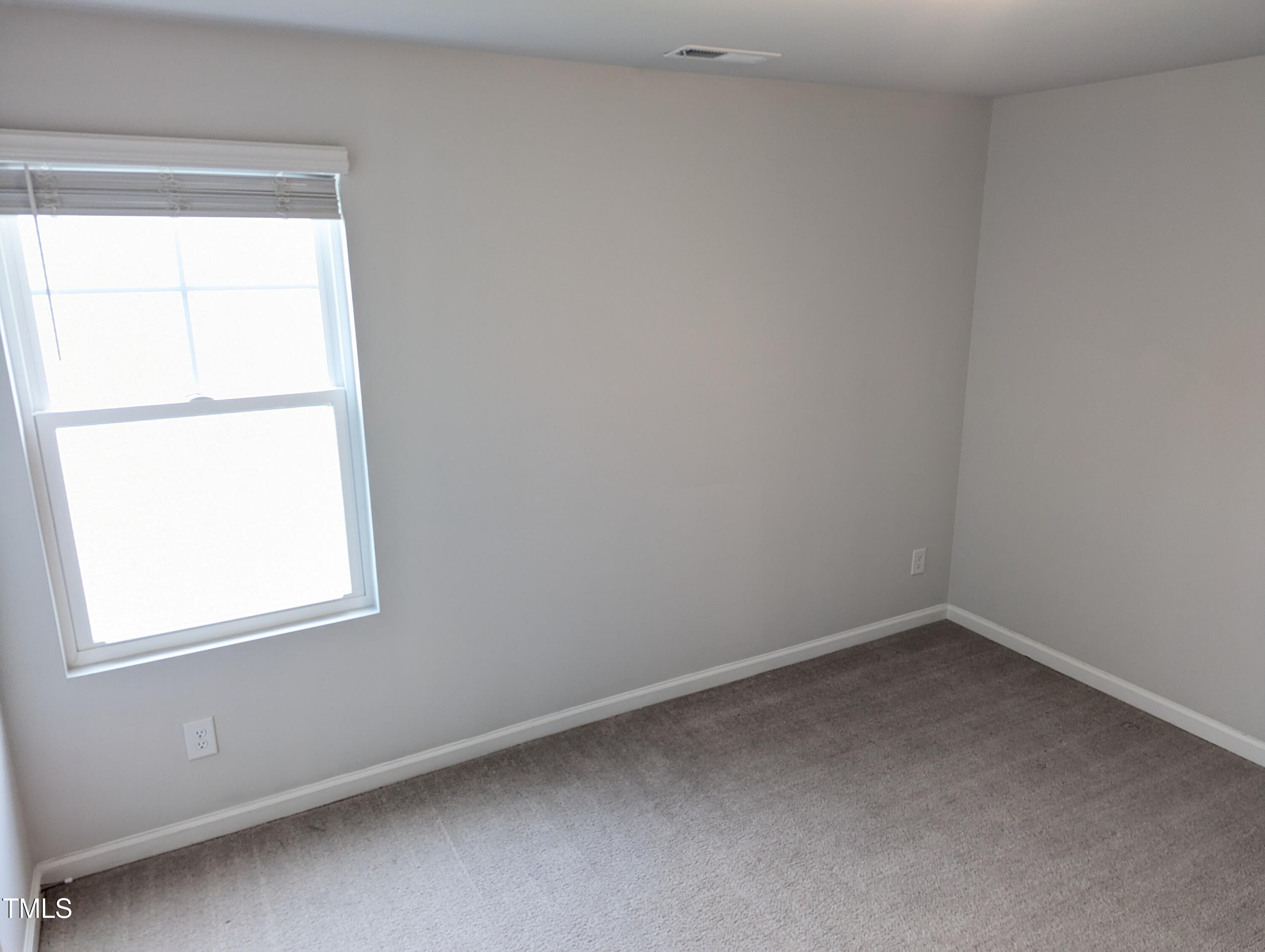 4020 Whitney Peak Drive Raleigh, NC 27616 - Photo 16 of 21 an empty room with a window