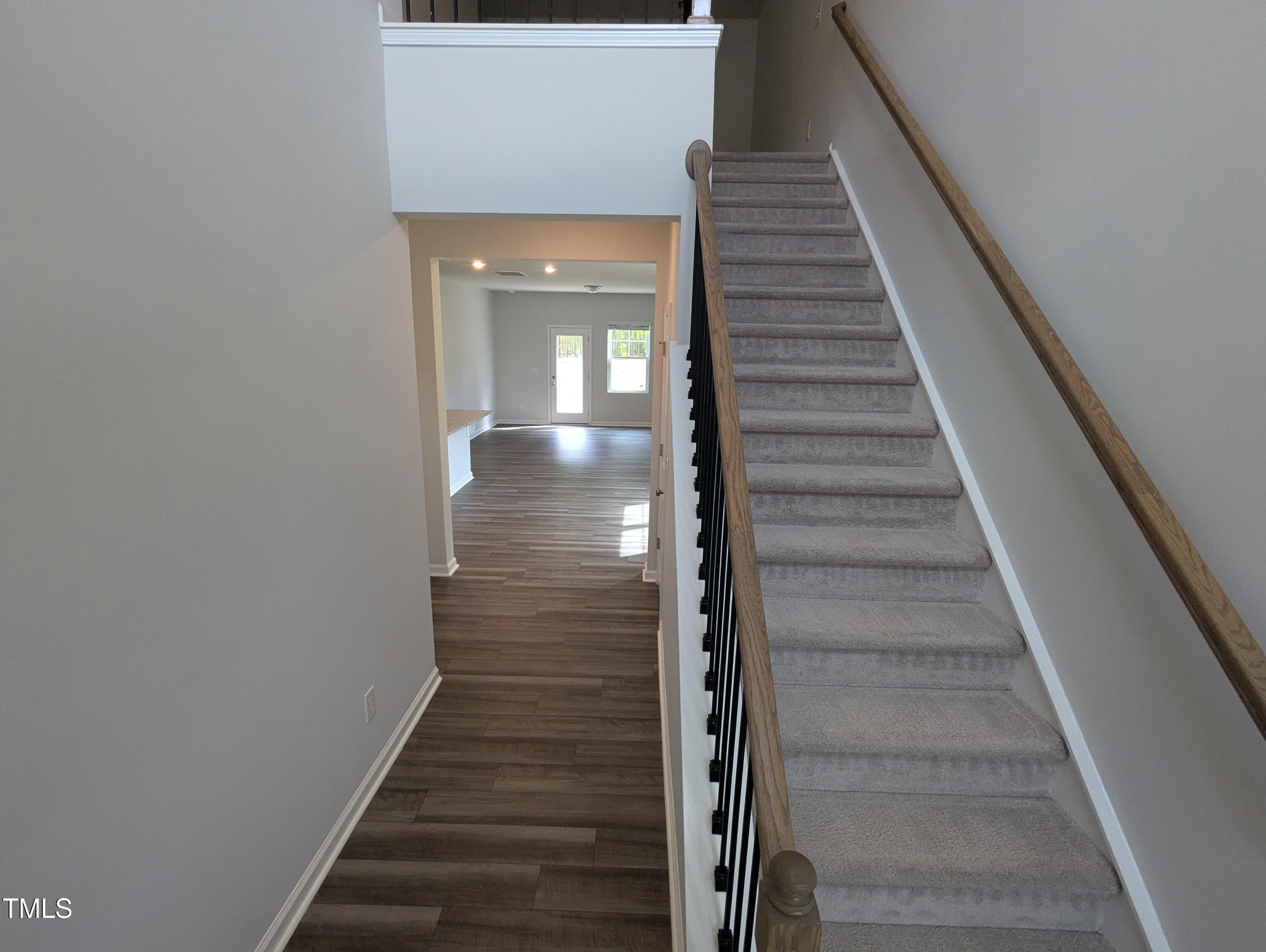 4020 Whitney Peak Drive Raleigh, NC 27616 - Photo 3 of 21 a view of entryway and gallery with wooden floor