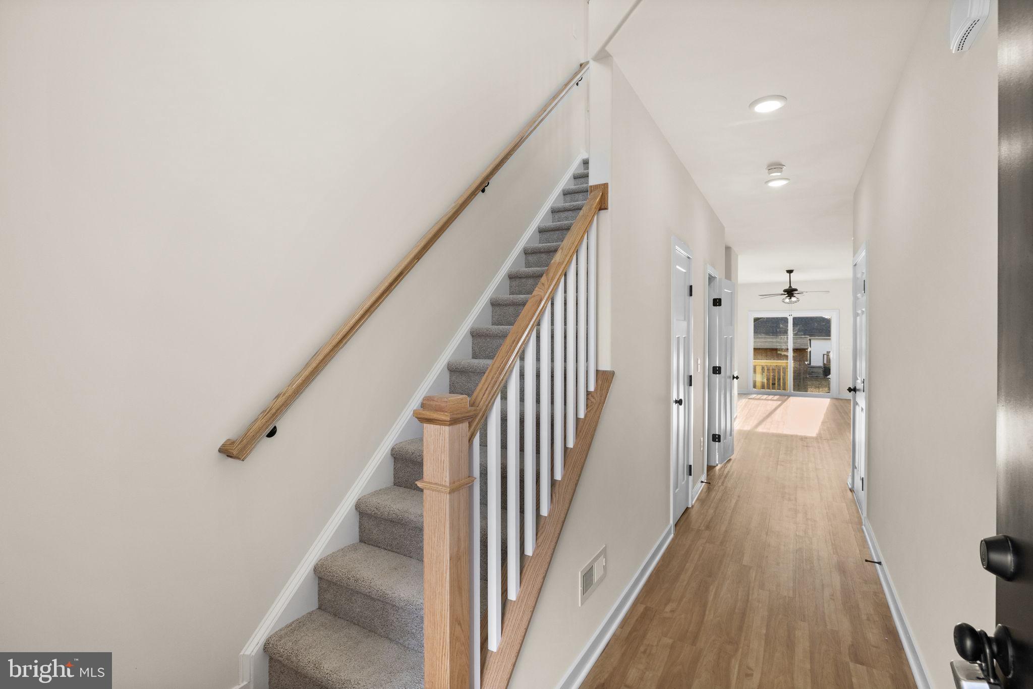 165 Bend Farm Road Fredericksburg, VA 22408 - Photo 11 of 51 a view of a hallway with wooden floor and staircase