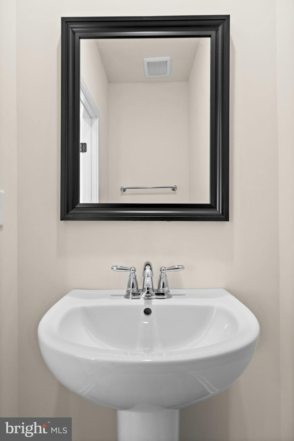 165 Bend Farm Road Fredericksburg, VA 22408 - Photo 12 of 51 a close up of a sink and mirror