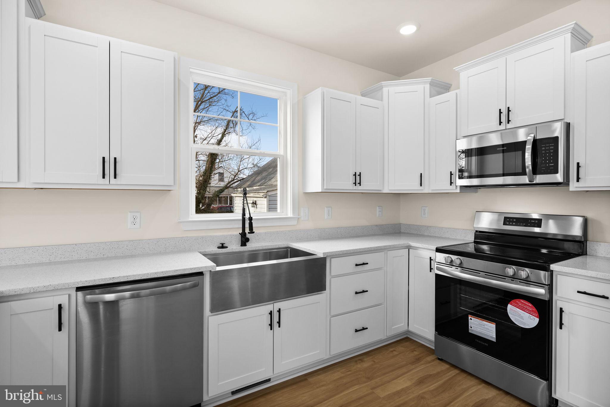 165 Bend Farm Road Fredericksburg, VA 22408 - Photo 15 of 51 a kitchen with white cabinets stainless steel appliances and sink