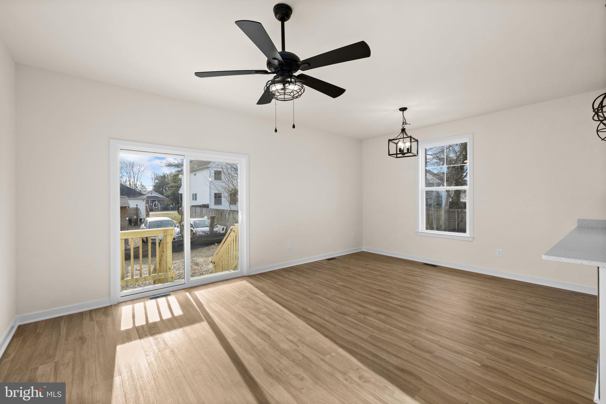 165 Bend Farm Road Fredericksburg, VA 22408 - Photo 19 of 51 a view of an empty room with wooden floor and a window