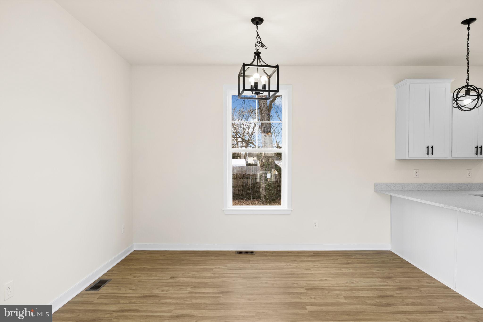 165 Bend Farm Road Fredericksburg, VA 22408 - Photo 27 of 51 a view of empty room with wooden floor and fan