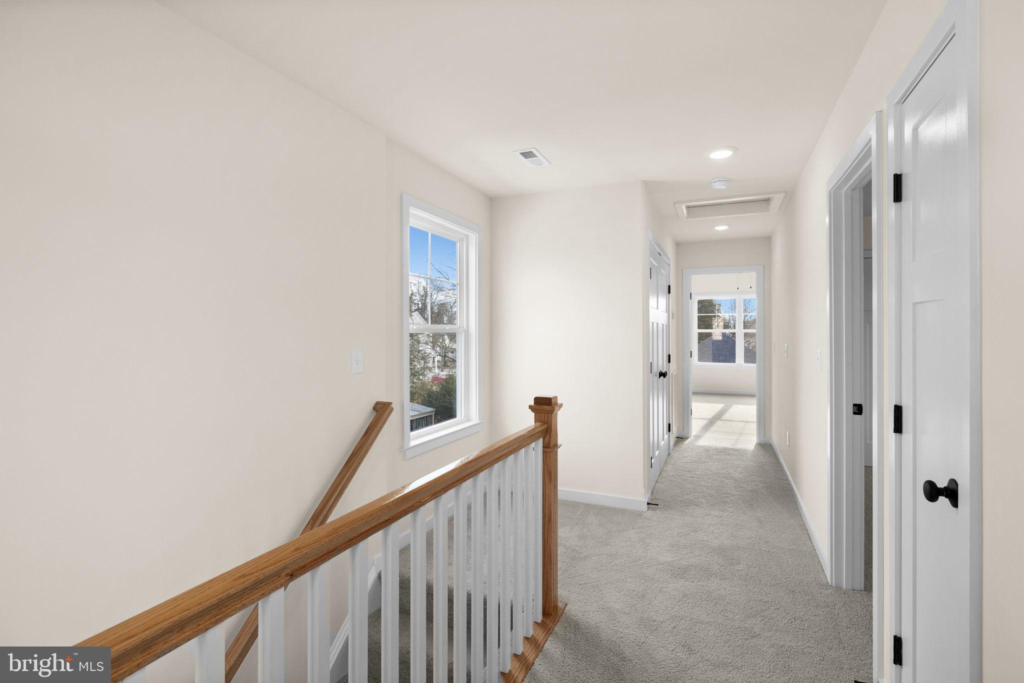 165 Bend Farm Road Fredericksburg, VA 22408 - Photo 29 of 51 a view of a hallway with wooden floor and a bathroom