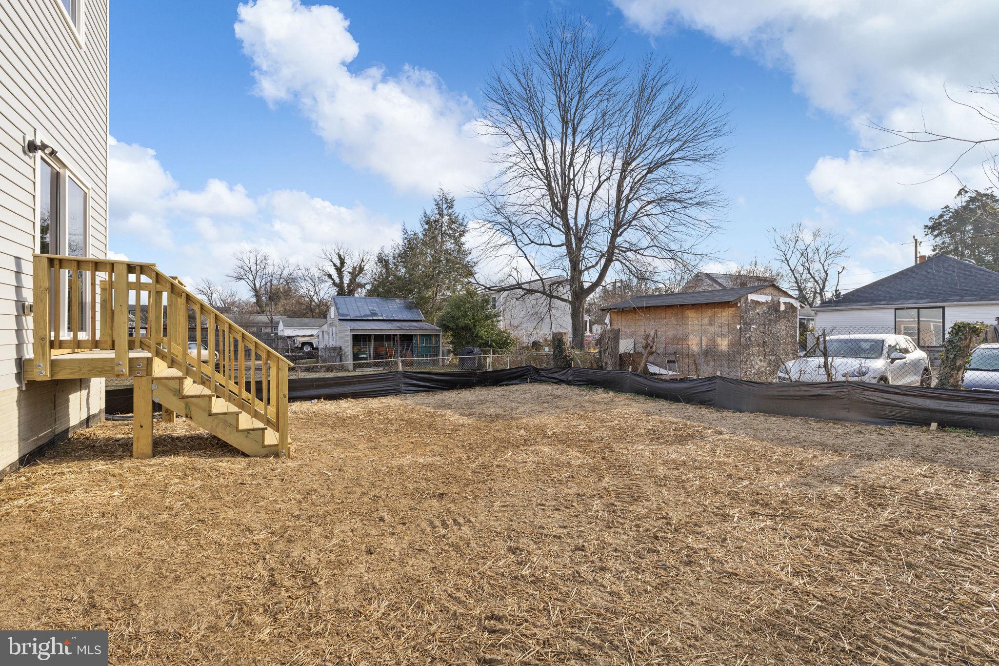 165 Bend Farm Road Fredericksburg, VA 22408 - Photo 46 of 51 a tall house with a large tree in front of it