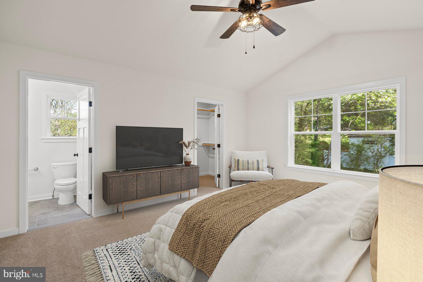 165 Bend Farm Road Fredericksburg, VA 22408 - Photo 9 of 51 a bedroom with a bed and a flat screen tv