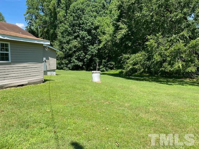 122 Bill Spain Road Henderson, NC 27537 - Photo 12 of 14 a backyard of a house with lots of green space