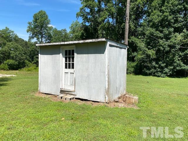 122 Bill Spain Road Henderson, NC 27537 - Photo 14 of 14 a view of a backyard with large trees