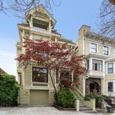 a spacious bathroom with a double vanity sink and a mirror