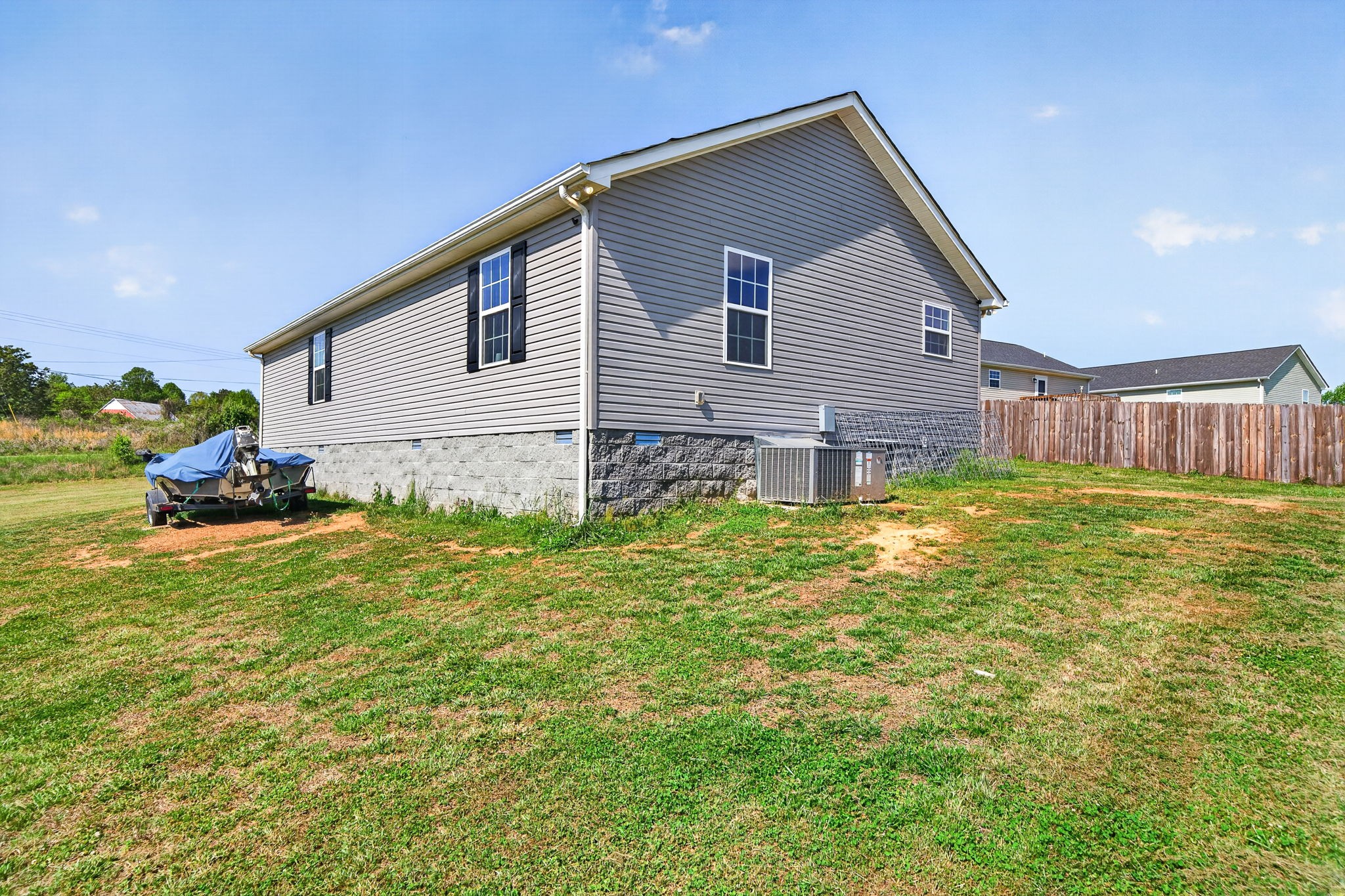 144 Liberty Road Sparta, TN 38583 - Photo 16 of 24 a view of a house with a yard and fence