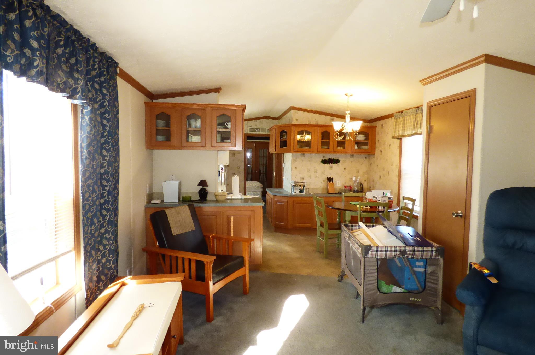 570 Layfield Road, Unit A Perkiomenville, PA 18074 - Photo 5 of 7 Cozy open-plan living space with charm.
