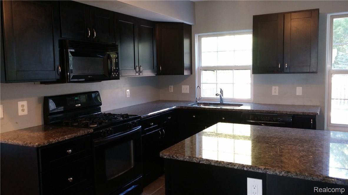 825 3rd Street Fenton, MI 48430 - Photo 3 of 26 Beautiful Contemporary Dark Cherry Cabinetry & Granite