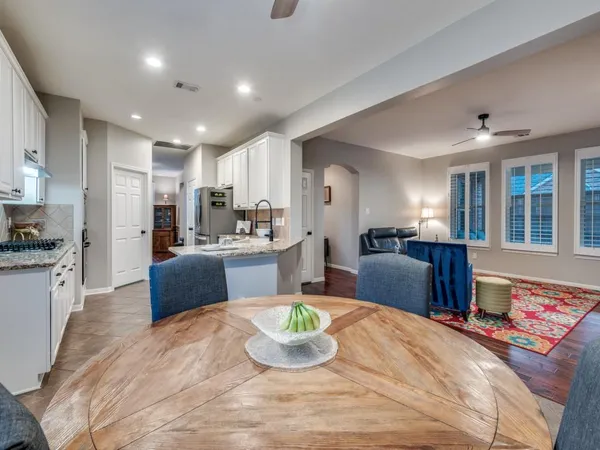 a living room with furniture fireplace and flat screen tv