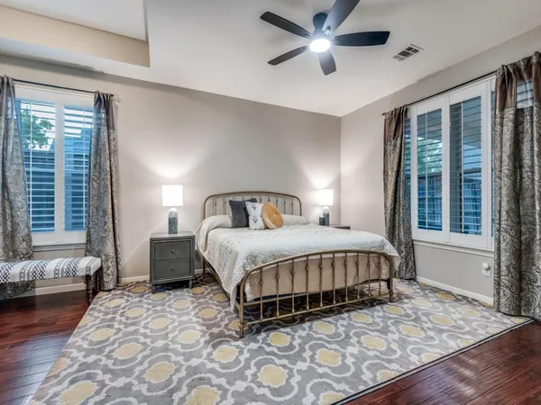 a living room with furniture ceiling fan and a fireplace