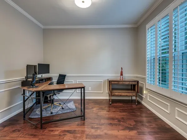 a large white kitchen with stainless steel appliances granite countertop a stove a sink and a microwave