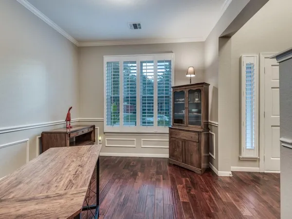 a kitchen with kitchen island granite countertop a sink stove and refrigerator