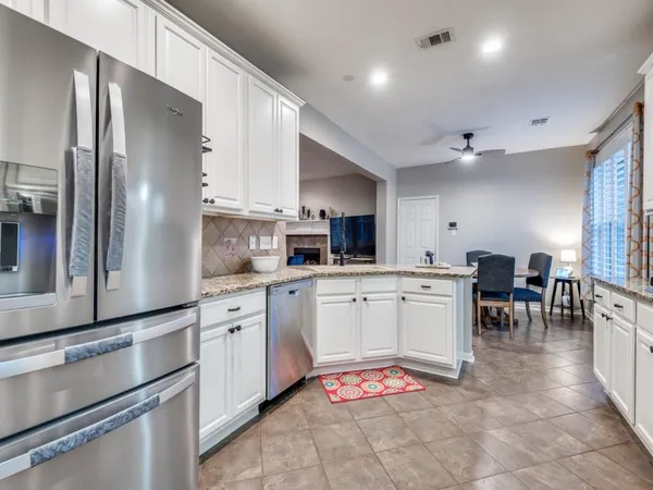 a living room with kitchen island furniture and a kitchen view