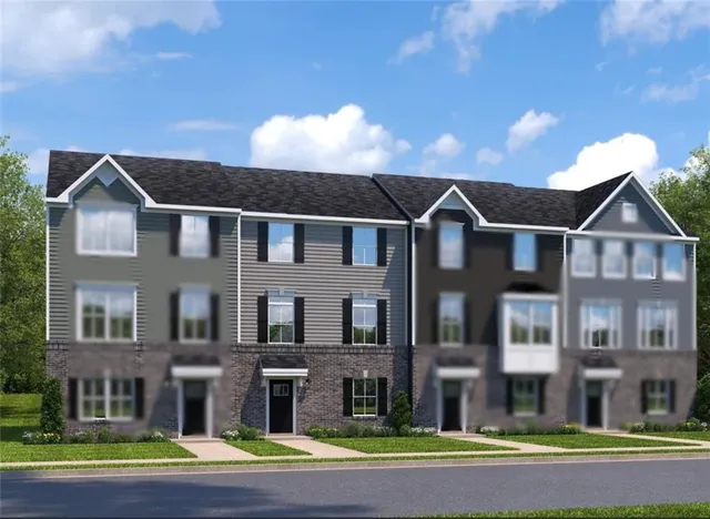 a view of a big house with a yard