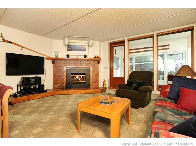 800 Copper Road, Unit 285 Copper Mountain, CO 80443 - Photo 10 of 17 a living room with furniture and a flat screen tv