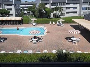 an aerial view of a house with outdoor space swimming pool and outdoor seating