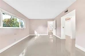 a view of a kitchen from the main door