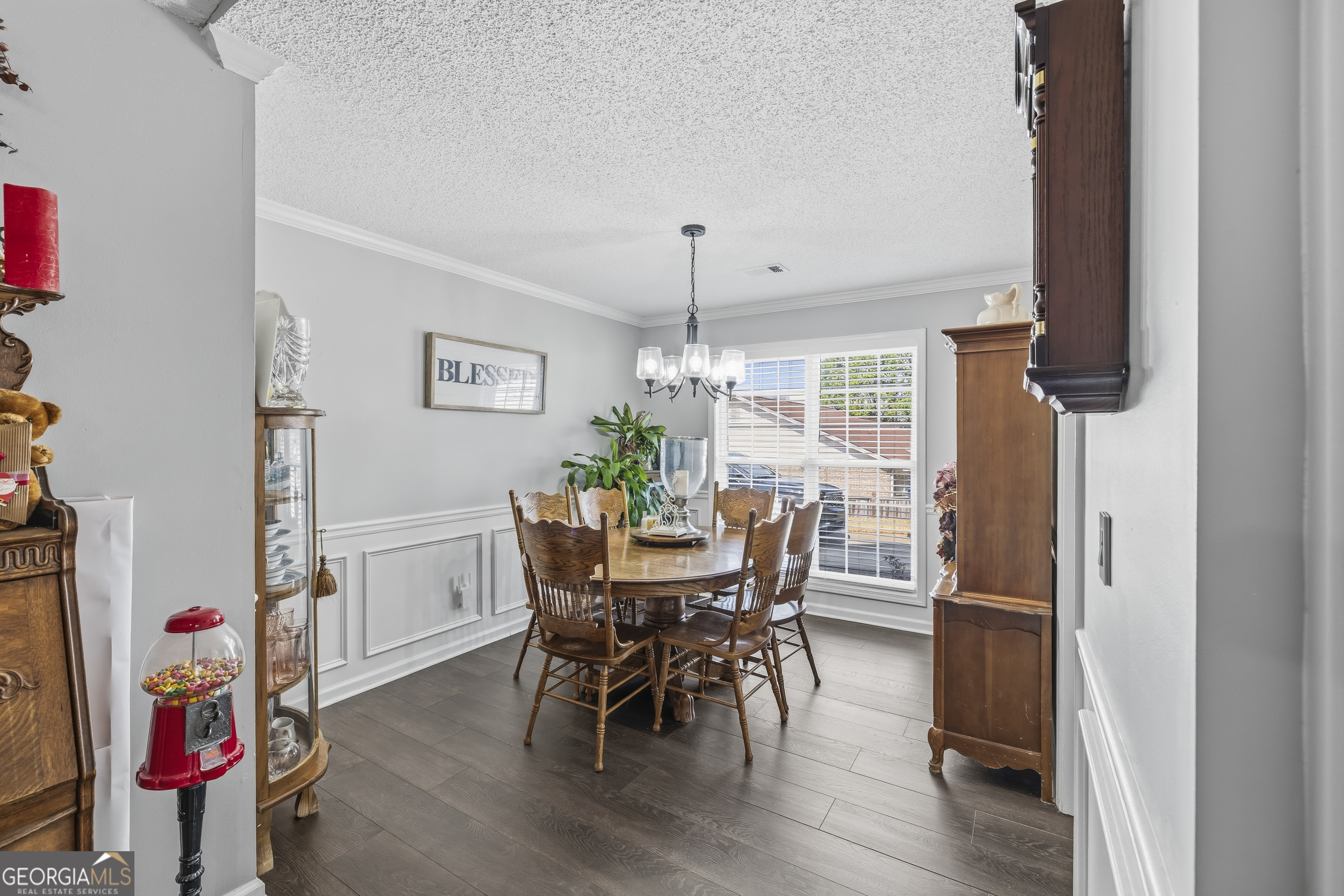 460 Flyway Lane Winder, GA 30680 - Photo 13 of 32 a view of a dining room with furniture and wooden floor